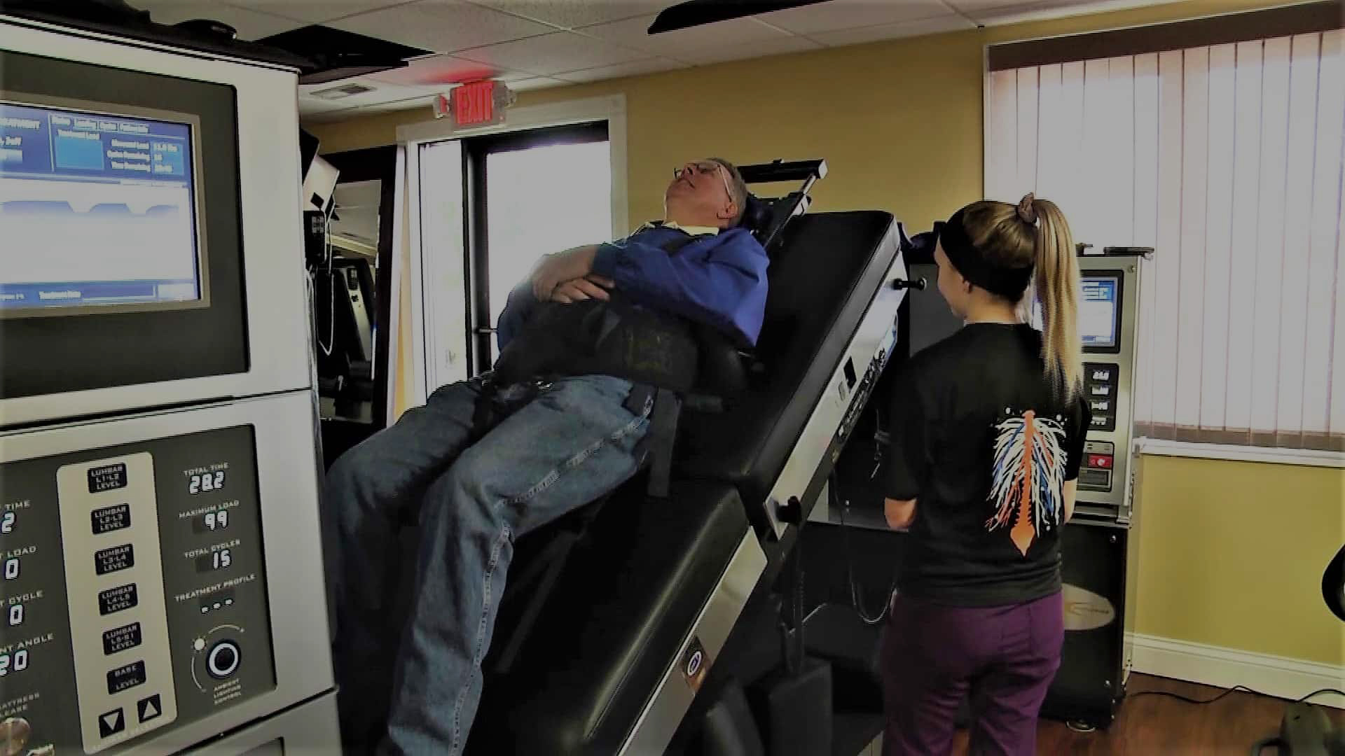 CIS staff member with a spinal decompression patient on the DRX 9000